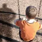 Child on a swing set