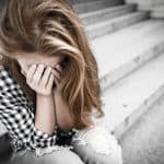 Child crying on steps